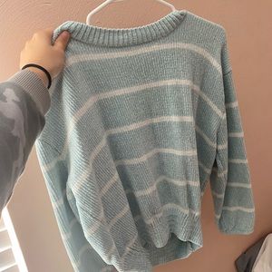light blue sweater